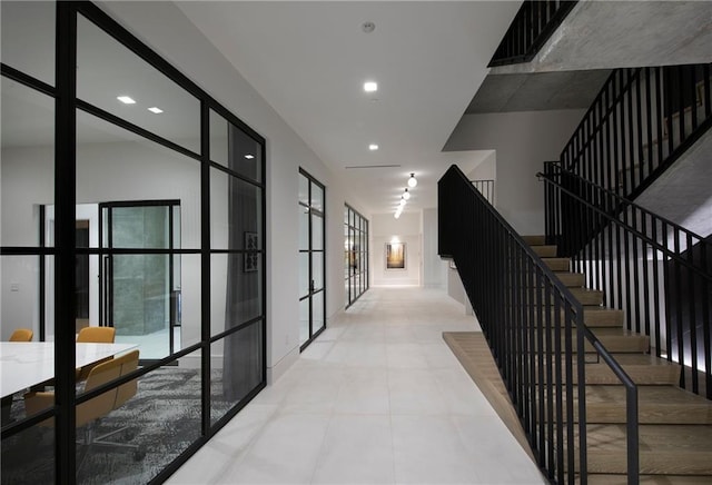 corridor featuring light tile flooring