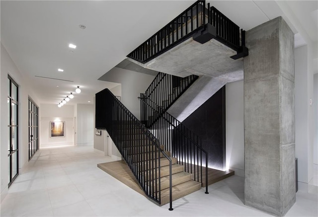 staircase with light tile floors