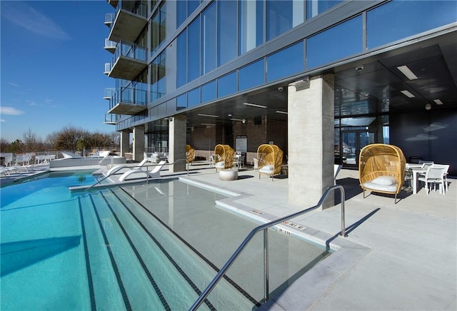 view of swimming pool with a patio