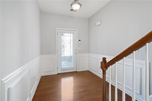 foyer entrance featuring dark wood-type flooring