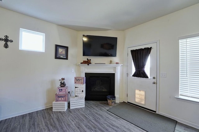 unfurnished living room with hardwood / wood-style flooring