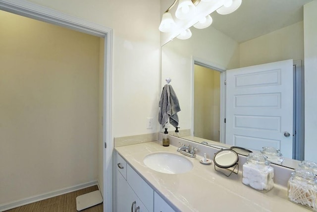 bathroom with vanity and wood-type flooring