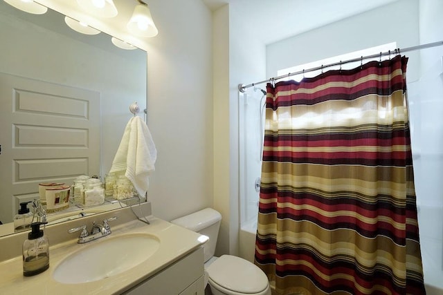 full bathroom featuring vanity, toilet, and shower / bath combo with shower curtain