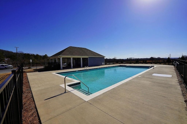 view of swimming pool with a patio area