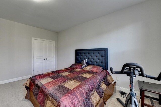 bedroom with carpet flooring and baseboards