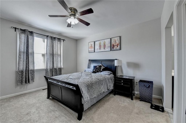bedroom with carpet, baseboards, and a ceiling fan