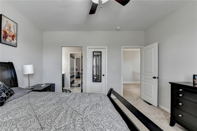 bedroom featuring light carpet, baseboards, and a ceiling fan