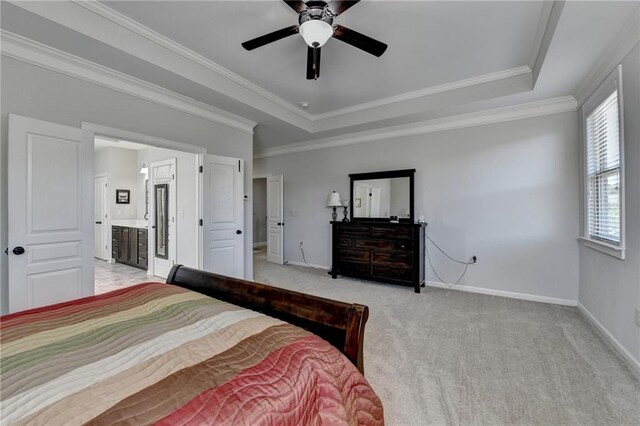 bedroom featuring crown molding, light colored carpet, and baseboards