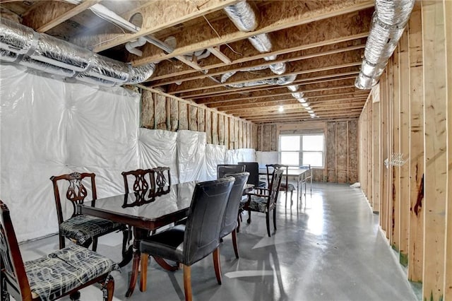 dining space featuring finished concrete floors