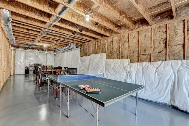 playroom featuring concrete flooring