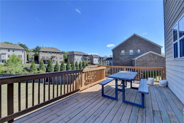 wooden terrace with a residential view