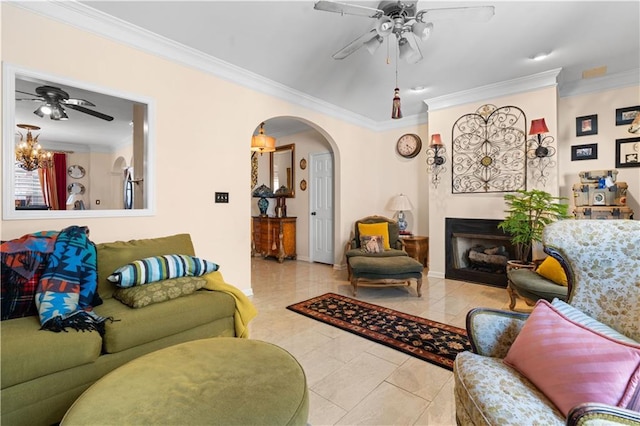 living room with ceiling fan and ornamental molding