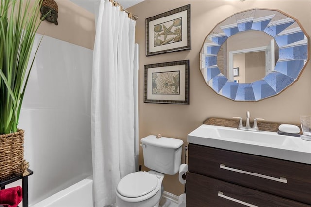 full bathroom with vanity, shower / tub combo, and toilet