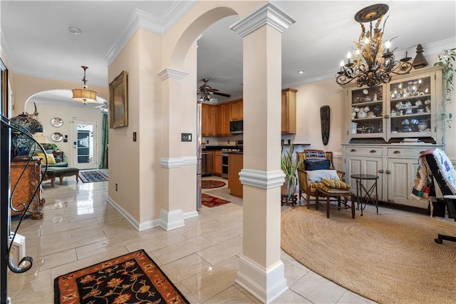 interior space featuring ornate columns and ornamental molding