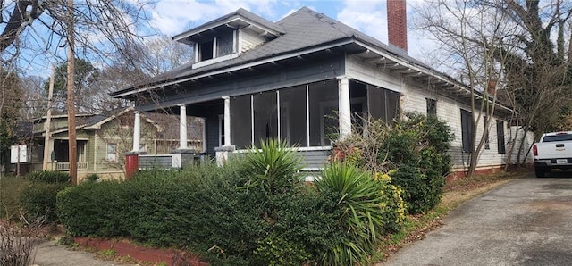 view of home's exterior featuring a sunroom