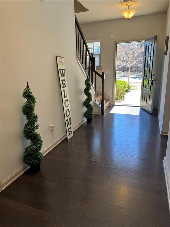 entryway with dark hardwood / wood-style floors