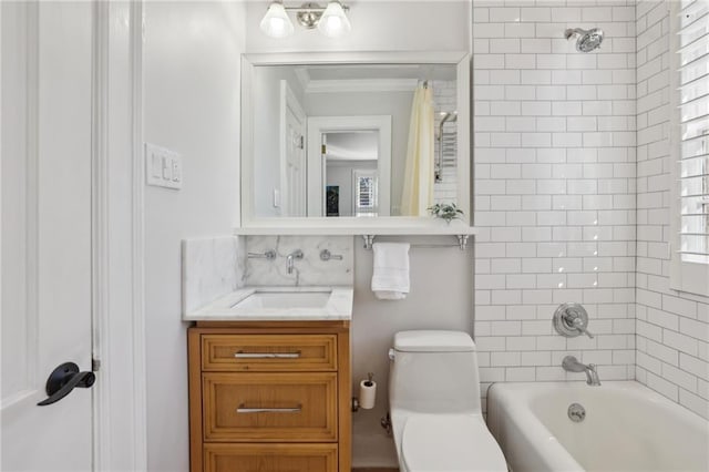 full bathroom with ornamental molding, tub / shower combination, vanity, and toilet