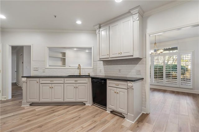 kitchen with dishwasher, dark countertops, and white cabinets