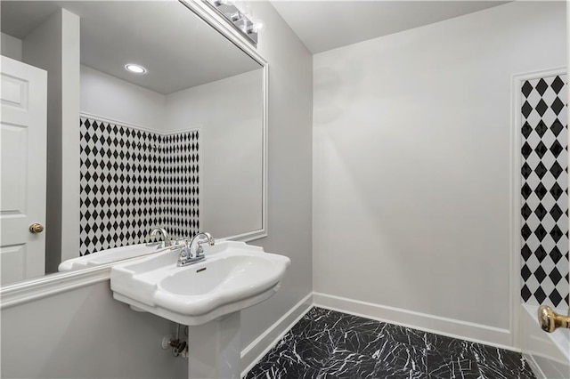 full bath featuring recessed lighting, marble finish floor, a sink, and baseboards