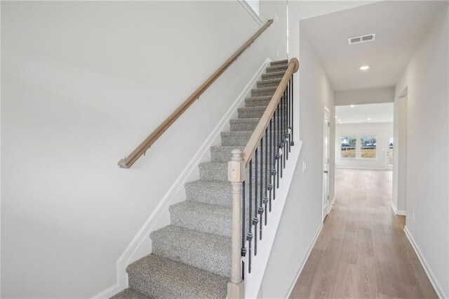 2026 Avalon Rdg, Conyers, GA 30013 - stairway with hardwood / wood-style floors