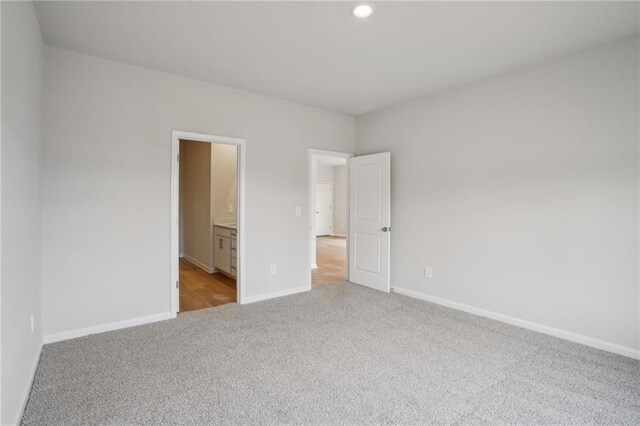 2026 Avalon Rdg, Conyers, GA 30013 - bathroom with hardwood / wood-style flooring, vanity, and a shower with door
