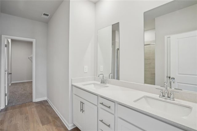 2026 Avalon Rdg, Conyers, GA 30013 - bathroom featuring wood-type flooring, a shower with shower door, and toilet