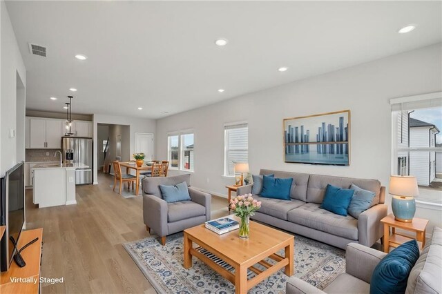 2026 Avalon Rdg, Conyers, GA 30013 - living room with sink and light hardwood / wood-style flooring