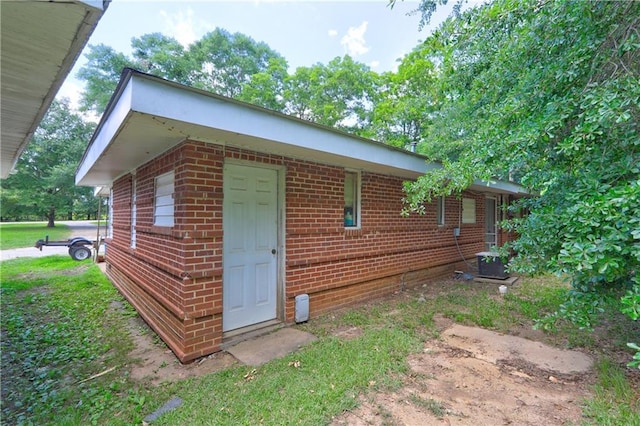 3494 Ga Highway 85 E, Manchester, GA 31816 - view of home's exterior with brick siding and central AC unit