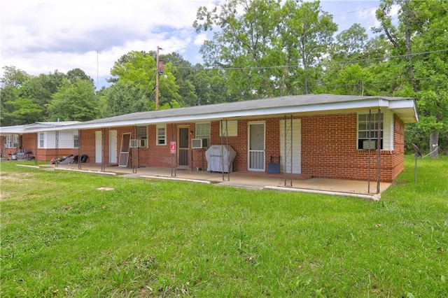 3494 Ga Highway 85 E, Manchester, GA 31816 - back of house with a lawn, brick siding, and covered porch