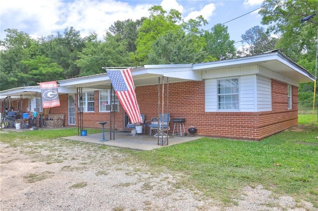 3494 Ga Highway 85 E, Manchester, GA 31816 - rear view of property with brick siding, a lawn, and a patio