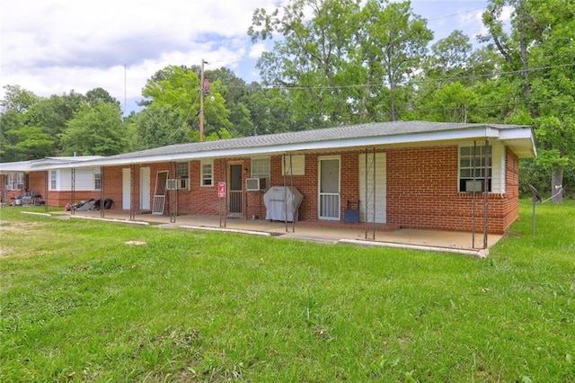 3494 Ga Highway 85 E, Manchester, GA 31816 - view of front of house featuring a front lawn, covered porch, and brick siding