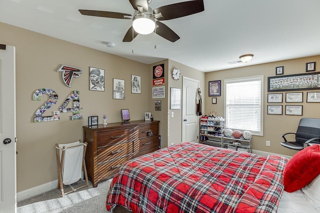 bedroom featuring a ceiling fan, light carpet, and baseboards