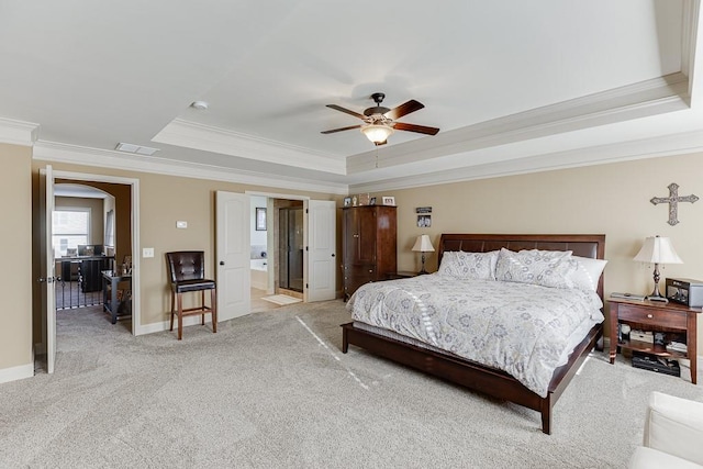 bedroom with light carpet, baseboards, visible vents, a tray ceiling, and crown molding