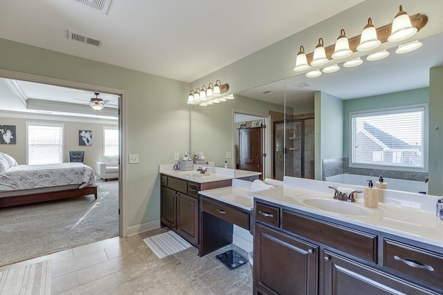 ensuite bathroom with visible vents, a shower stall, ensuite bath, vanity, and baseboards