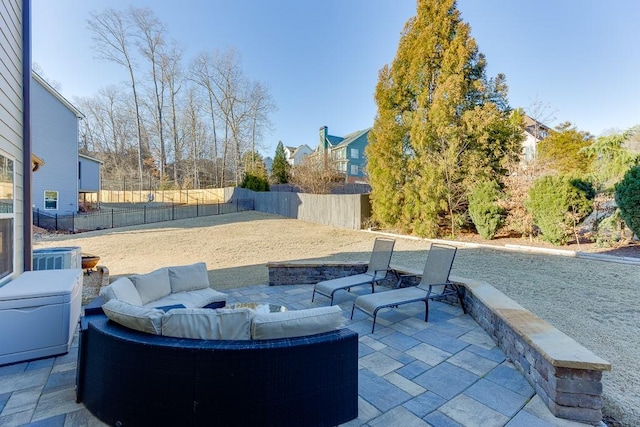 view of patio featuring outdoor lounge area and a fenced backyard