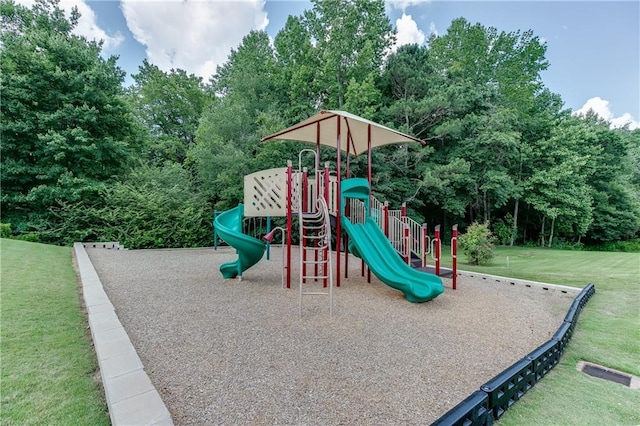 community jungle gym featuring a yard