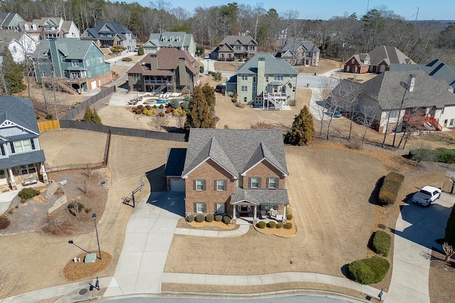 birds eye view of property with a residential view