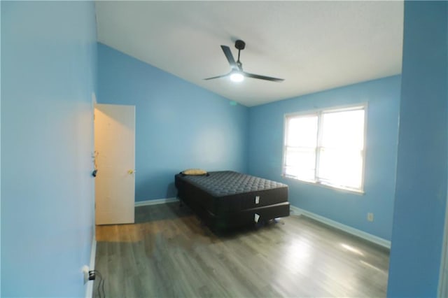 bedroom with ceiling fan and wood-type flooring