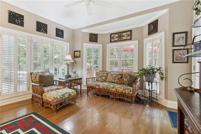 sitting room featuring hardwood / wood-style floors, plenty of natural light, and ornamental molding