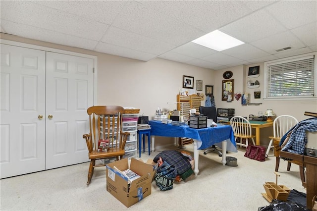 home office with carpet and a drop ceiling