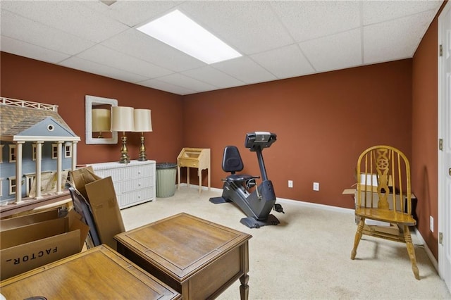 carpeted office space featuring a drop ceiling