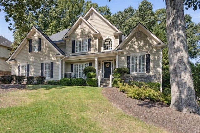 craftsman inspired home with a front yard