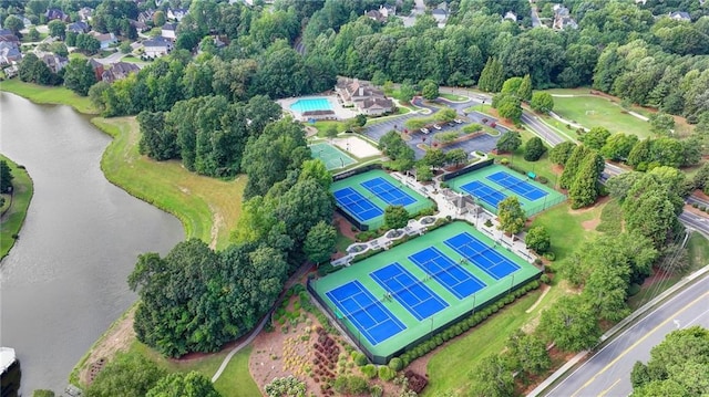 birds eye view of property with a water view