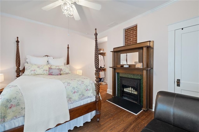 315 W Ave, Cartersville, GA 30120 - bedroom featuring wood finished floors, ornamental molding, a tile fireplace, a ceiling fan, and baseboards