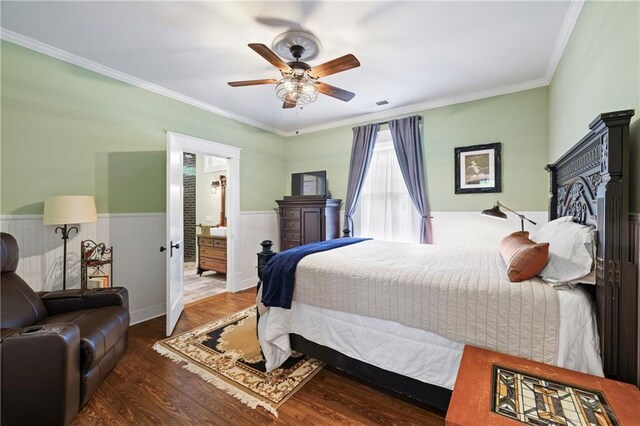 315 W Ave, Cartersville, GA 30120 - bedroom featuring a wainscoted wall, wood finished floors, ornamental molding, a ceiling fan, and connected bathroom