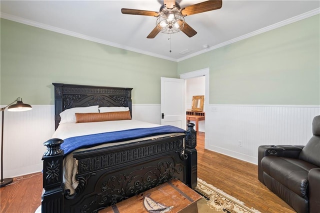 315 W Ave, Cartersville, GA 30120 - bedroom with wainscoting, wood finished floors, ornamental molding, and a ceiling fan
