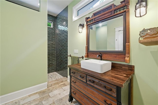 315 W Ave, Cartersville, GA 30120 - bathroom with vanity, walk in shower, baseboards, and stone finish flooring