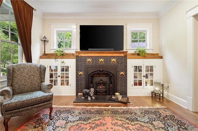 315 W Ave, Cartersville, GA 30120 - living area with wood finished floors, a brick fireplace, ornamental molding, and baseboards