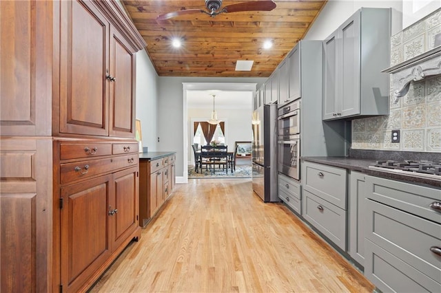 315 W Ave, Cartersville, GA 30120 - kitchen featuring wood ceiling, dark countertops, a ceiling fan, light wood-type flooring, and stainless steel fridge