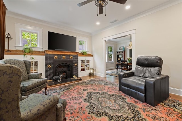 315 W Ave, Cartersville, GA 30120 - living area featuring wood finished floors, crown molding, a ceiling fan, a brick fireplace, and baseboards